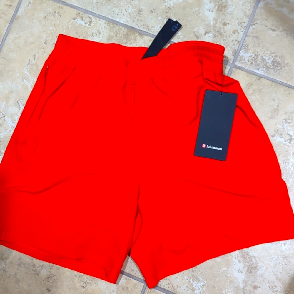 Lulu Lemon orange pace breaker shorts M